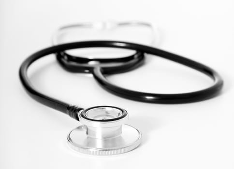 Single stethoscope as it is used by medical personnel. Shallow depth of focus on foreground.