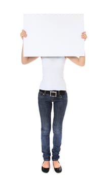 Attractive young woman holding blank sign in front of her head. All on white background.