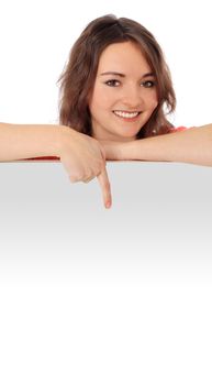 Attractive young woman pointing with finger. All on white background.