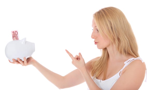 Attractive blond woman being angry with her piggy bank. All on white background.