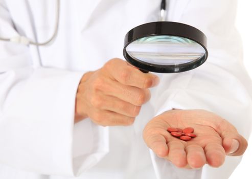 Doctor checking pharmaceuticals. All on white background.