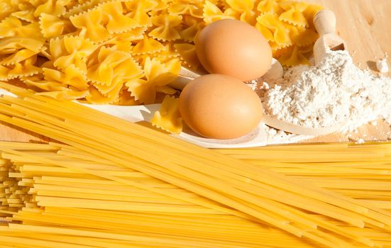 Food background: macaroni, spagetti, egg, flour