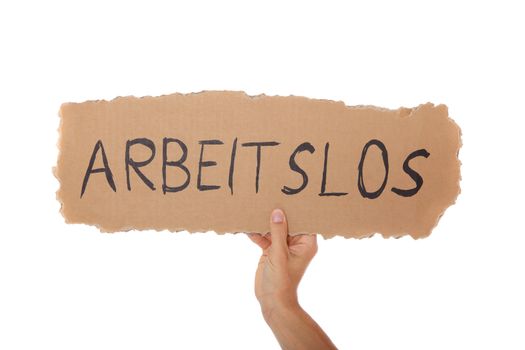 Person holding cardboard sign with the german term "arbeitslos" (Engl.: jobless). All on white background.