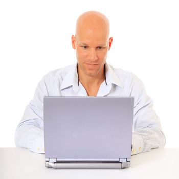 Young man working with laptop. All on white background.