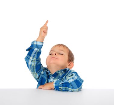 Cute caucasian boy points with finger. All on white background.