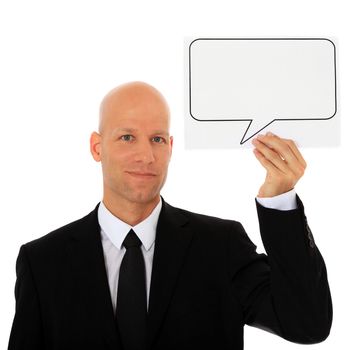 Attractive businessman holding speech bubble next to his head. All on white background.