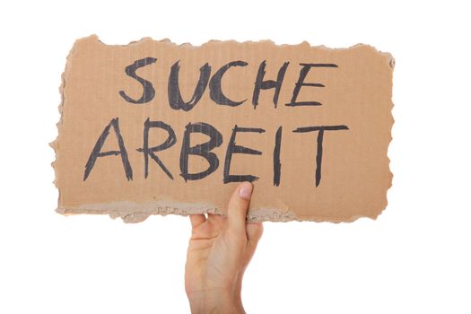 Person holding cardboard sign with the german term "suche arbeit" (Engl.: hunting for a job). All on white background.