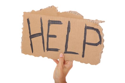 Male hand holding cardboard sign with the term help. All on white background.