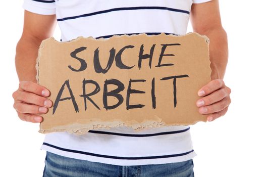 Male person holding cardboard sign with the german term "suche arbeit" (Engl.: hunting for a job). All on white background.