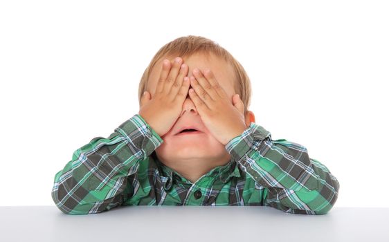 Cute caucasian boy hides himself. All on white background.