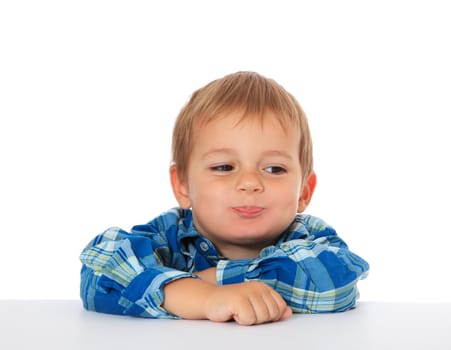 Cute caucasian boy fooling around. All on white background.