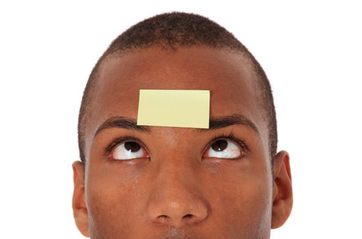 Attractive black with blank post-it note on his forehead. All on white background.