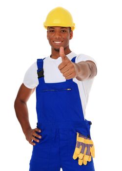 Attractive black manual worker showing thumb up. All on white background.