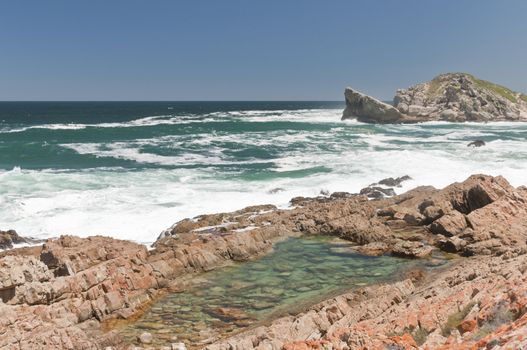 The view of the waves washing over the rocks, Robberg, South Africa