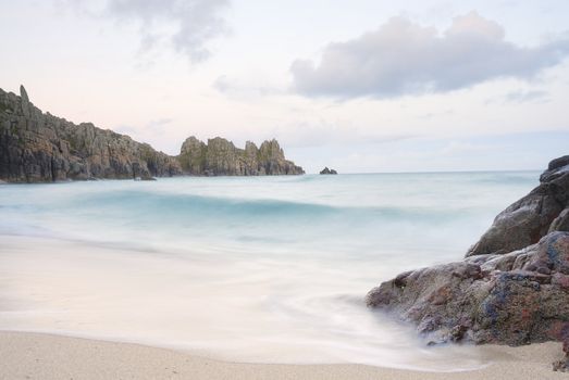 Pedn vounder beach, one of Cornwall's best beaches with stunning cliffs of Treryn Dinas, crystal clear water and a beautiful sandy beach.
 
 On a spring low tide one can walk to Pedn Vounder from neighbouring Porthcurno beach but be warned, as the tide comes in you will not only find yourself cut off but facing a climb up the steep cliff "path"
 
 The headland to the east of the beach is the location of the famous Logan Rock, a rectangular block of granite which weighs about 70 tons, and which can be rocked back and forth by one person.
 
 Pedn Vounder is an unoffical naturist beach