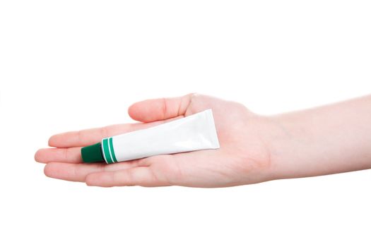 tube with ointment in hand, isolated on a white background 
