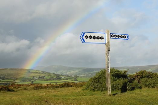 Dollar symbols on signpost. Focus on signpost in foreground.