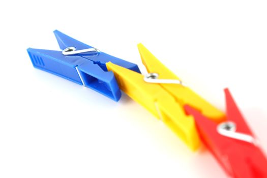 colored clothespins isolated on white background
