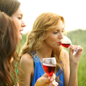 girl drink wine on nature background