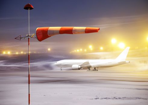 Meteorology windsock inflated by wind in airport at non-flying night
