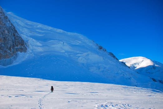 Extreme Sport. Lone hikers in winter mountains