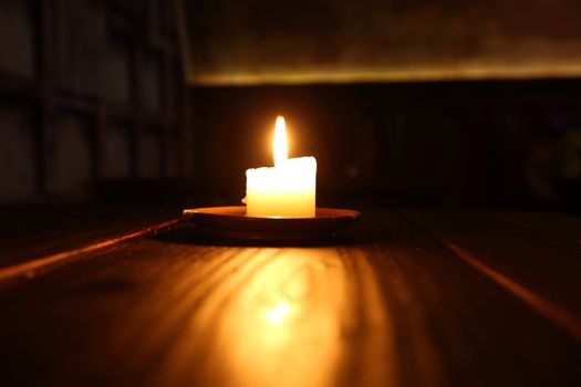  candle in dark room close up