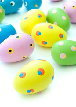Closeup of painted easter eggs on a white background