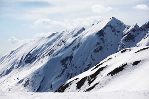 top of mountains in blue sky