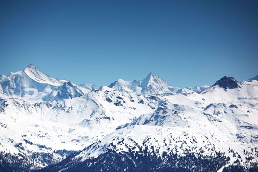 top of mountains sun in blue sky