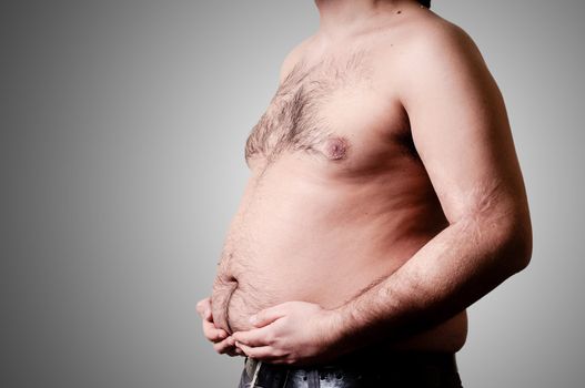 belly fat man on gray background