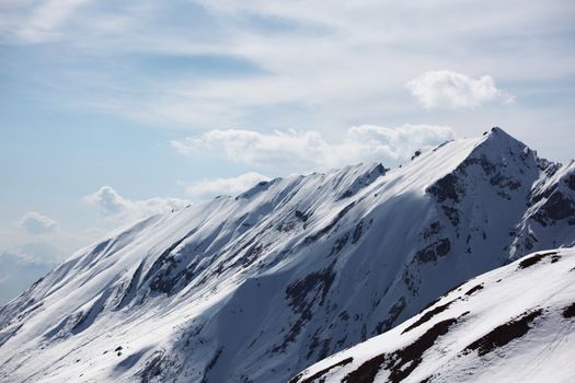 top of mountains in blue sky
