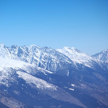 top of mountains sun in blue sky