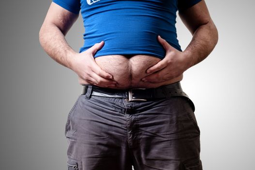 belly fat man on gray background