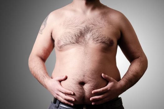 belly fat man on gray background