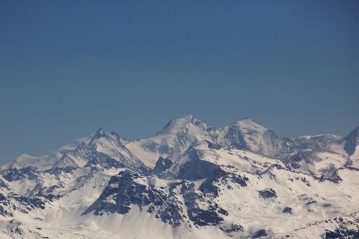 top of mountains in blue sky