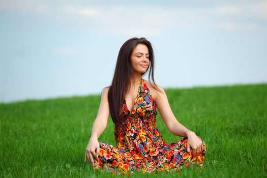 happy woman on green grass 