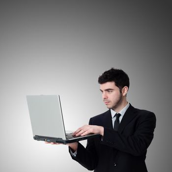 business man with notebook on gray background