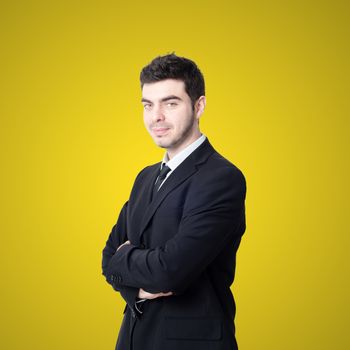 portrait of elegant businessman on yellow background