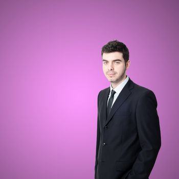 portrait of elegant businessman on pink background