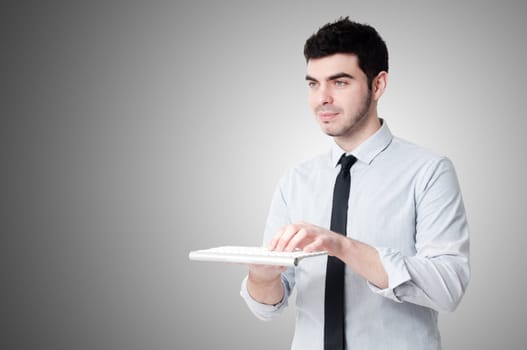 business man holding keybord n gray background