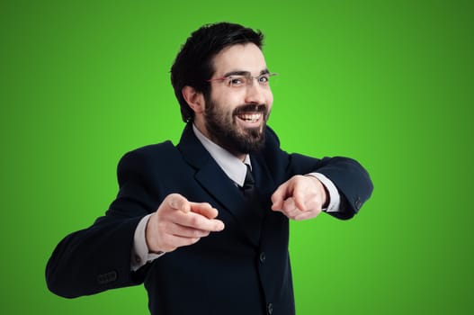 success business man pointing on green background
