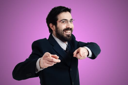 success business man pointing on pink background