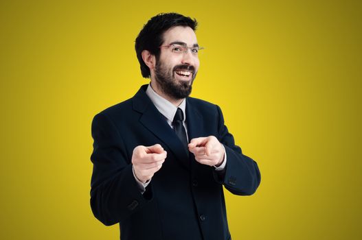 success business man pointing on yellow background