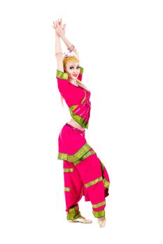 full length portrait of indian woman dancing in studio.  Isolated on white background.