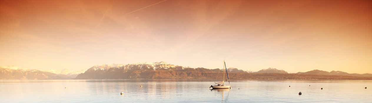 yacht in lake of geneva landscape on sunrise