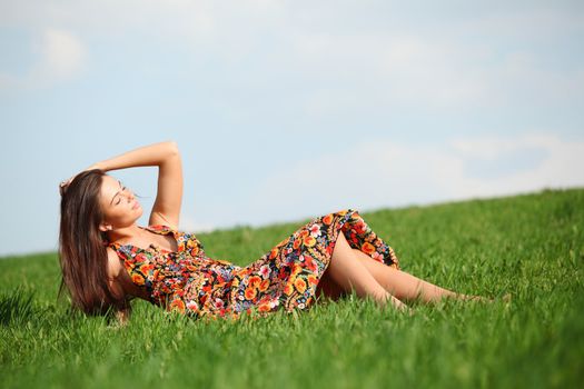 happy woman on green grass 