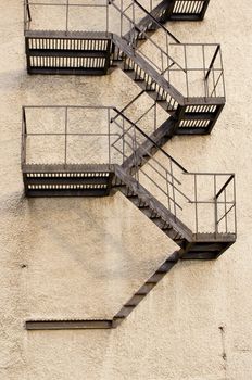 Old building metal emergency exit stairs leading down.