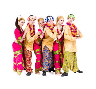 dance team dressed in Indian costumes posing.  Isolated on white background in full length.