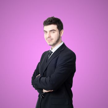 portrait of elegant businessman on pink background