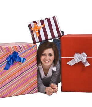 Young woman having fun with some gift boxes